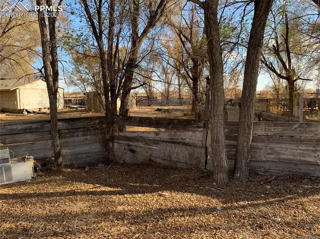 a view of a backyard of the house