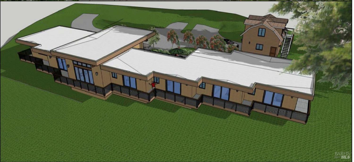 an aerial view of a house with swimming pool patio and deck