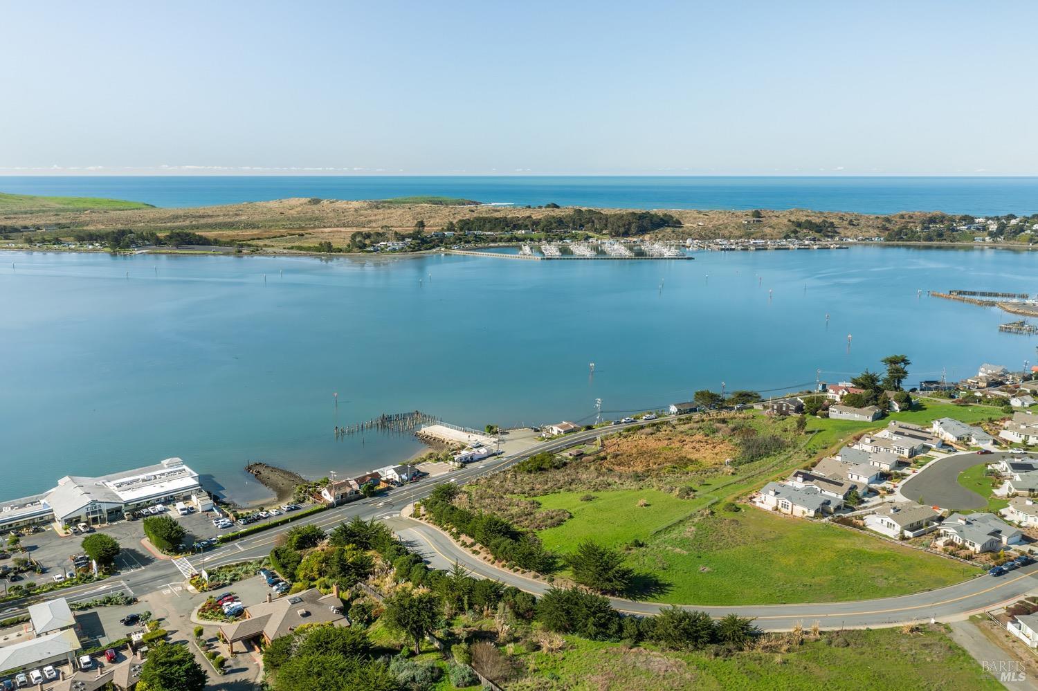 153 Harbor View Way Bodega Bay, CA 94923 - Photo 11 of 18 an aerial view of a house with a lake view