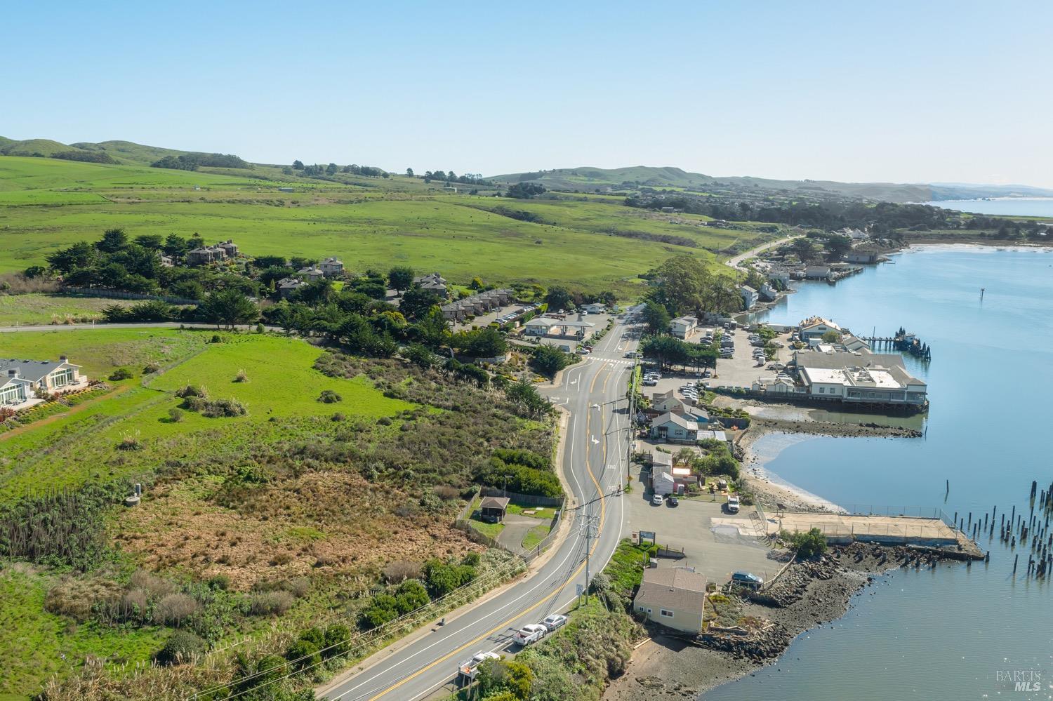 153 Harbor View Way Bodega Bay, CA 94923 - Photo 11 of 16 a view of a lake with a mountain