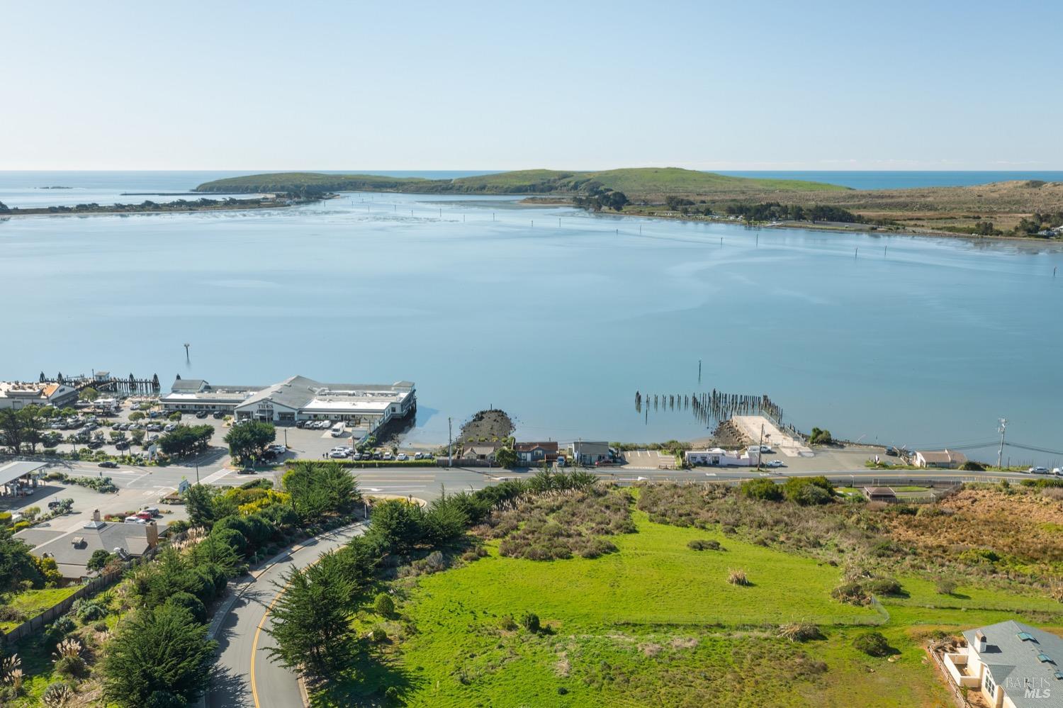 153 Harbor View Way Bodega Bay, CA 94923 - Photo 6 of 16 a view of a lake with a mountain