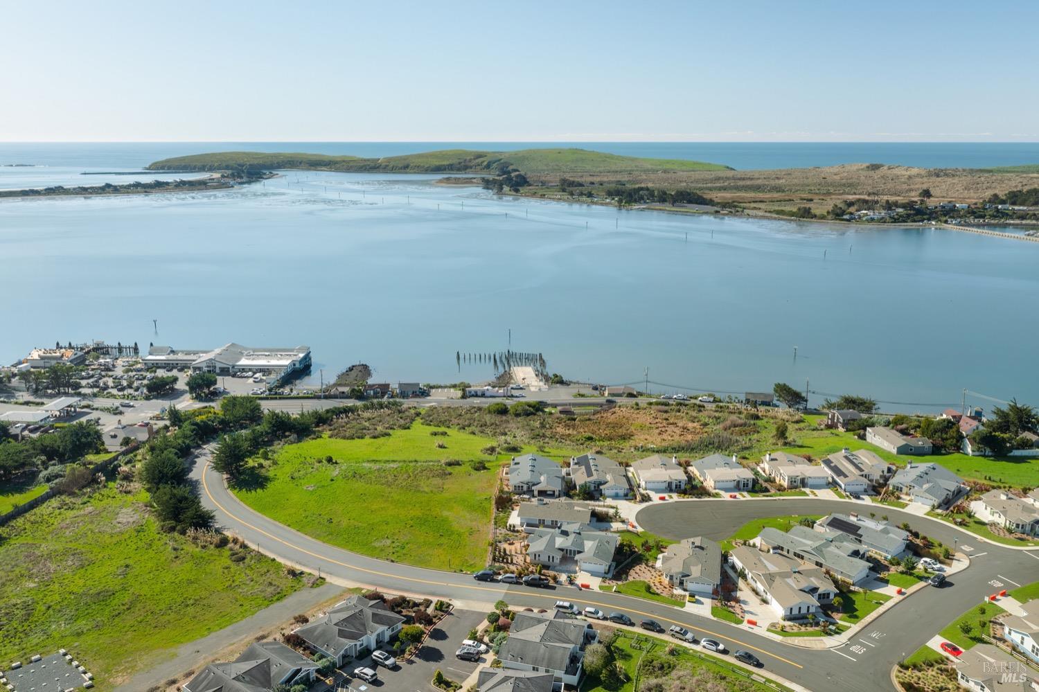 153 Harbor View Way Bodega Bay, CA 94923 - Photo 9 of 18 an aerial view of a house with a lake view