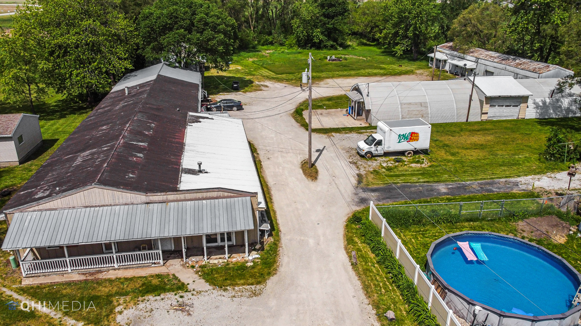 6920 S Route St. Anne, IL 60964 - Photo 4 of 7 an aerial view of a house with swimming pool and patio