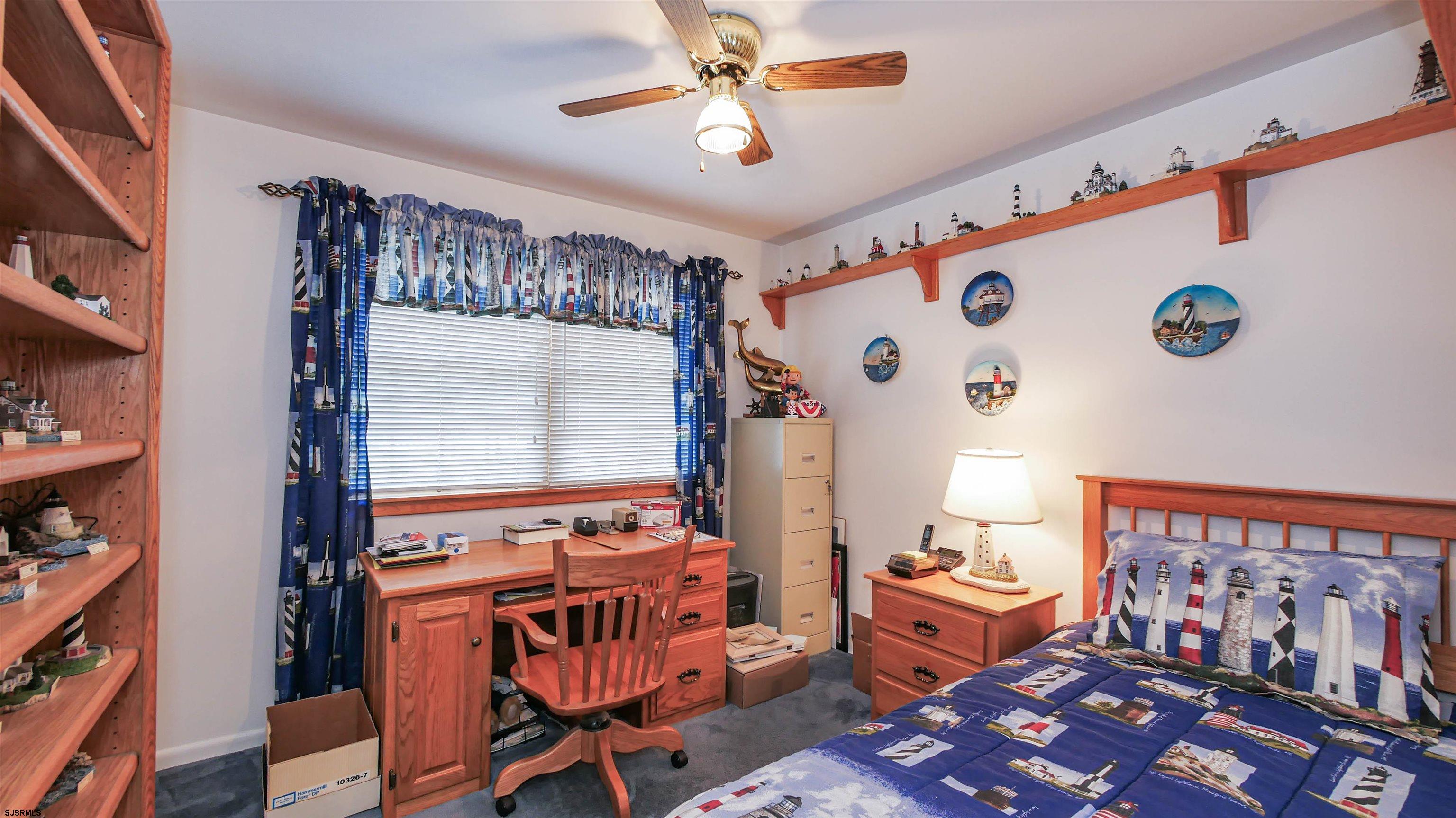 2042 Sutton Avenue Northfield, NJ 08225 - Photo 20 of 32 a bedroom with furniture and a window