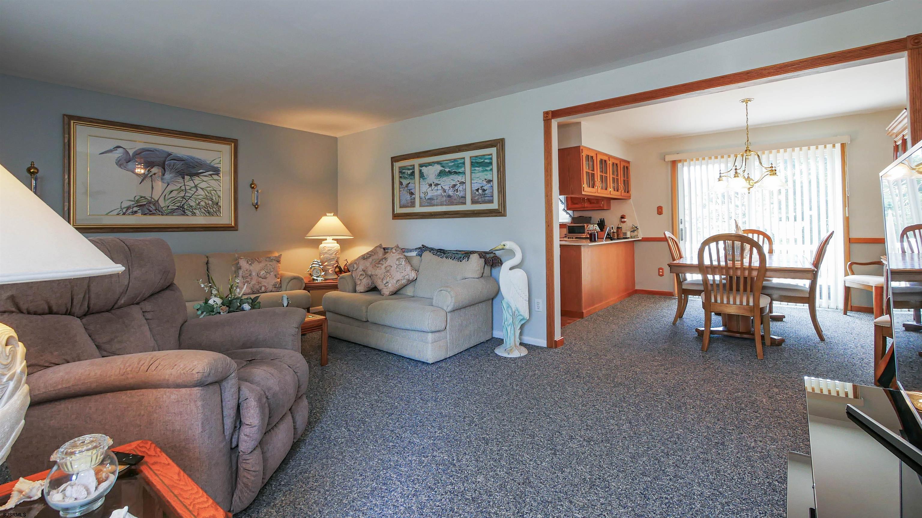 2042 Sutton Avenue Northfield, NJ 08225 - Photo 5 of 32 a living room with furniture and a chandelier