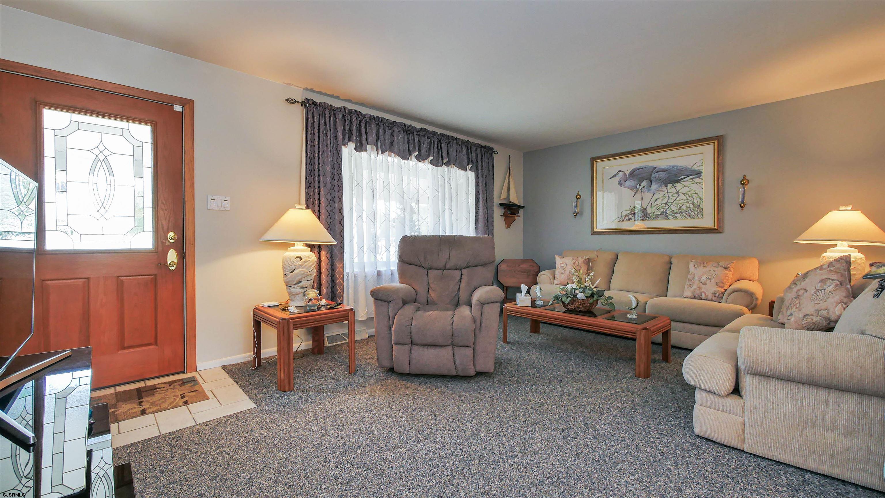 2042 Sutton Avenue Northfield, NJ 08225 - Photo 6 of 32 a living room with furniture and a large window