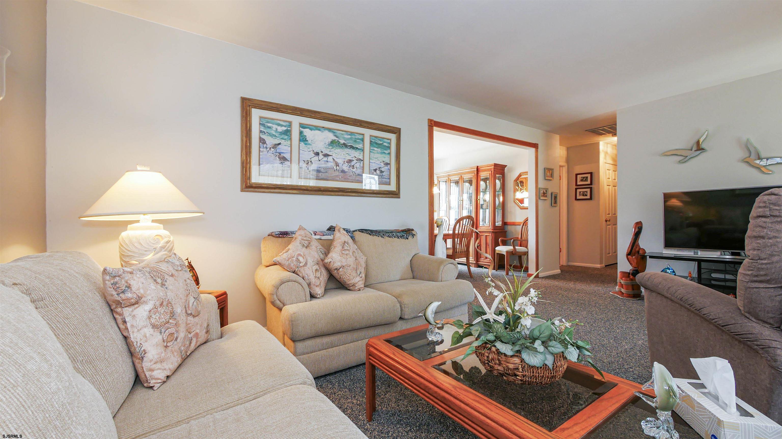 2042 Sutton Avenue Northfield, NJ 08225 - Photo 7 of 32 a living room with furniture and a flat screen tv