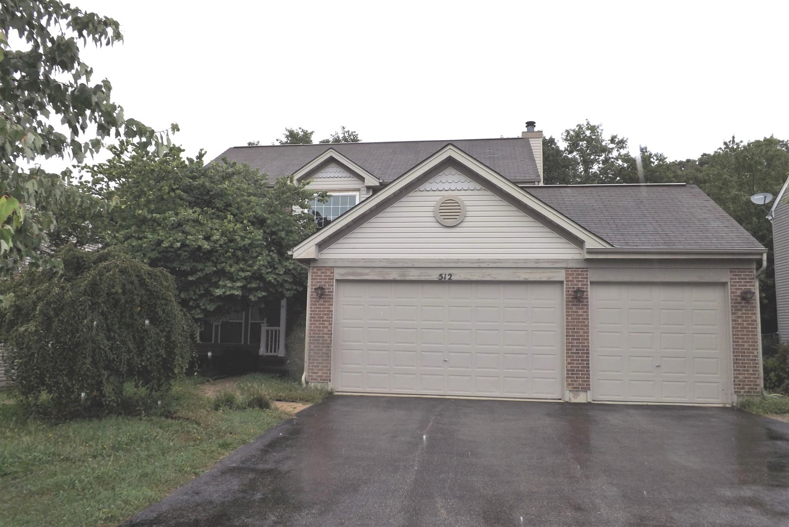 512 West Wildspring Road Round Lake, IL 60073 - Photo 1 of 16 a view of garage and yard