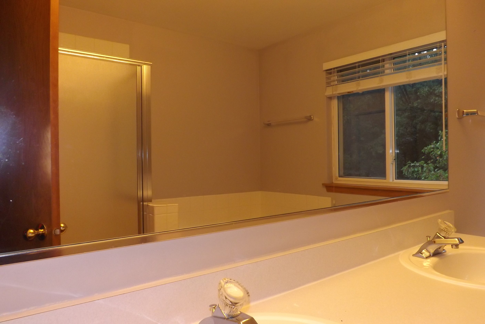 512 West Wildspring Road Round Lake, IL 60073 - Photo 11 of 16 a bathroom with a bathtub and a shower