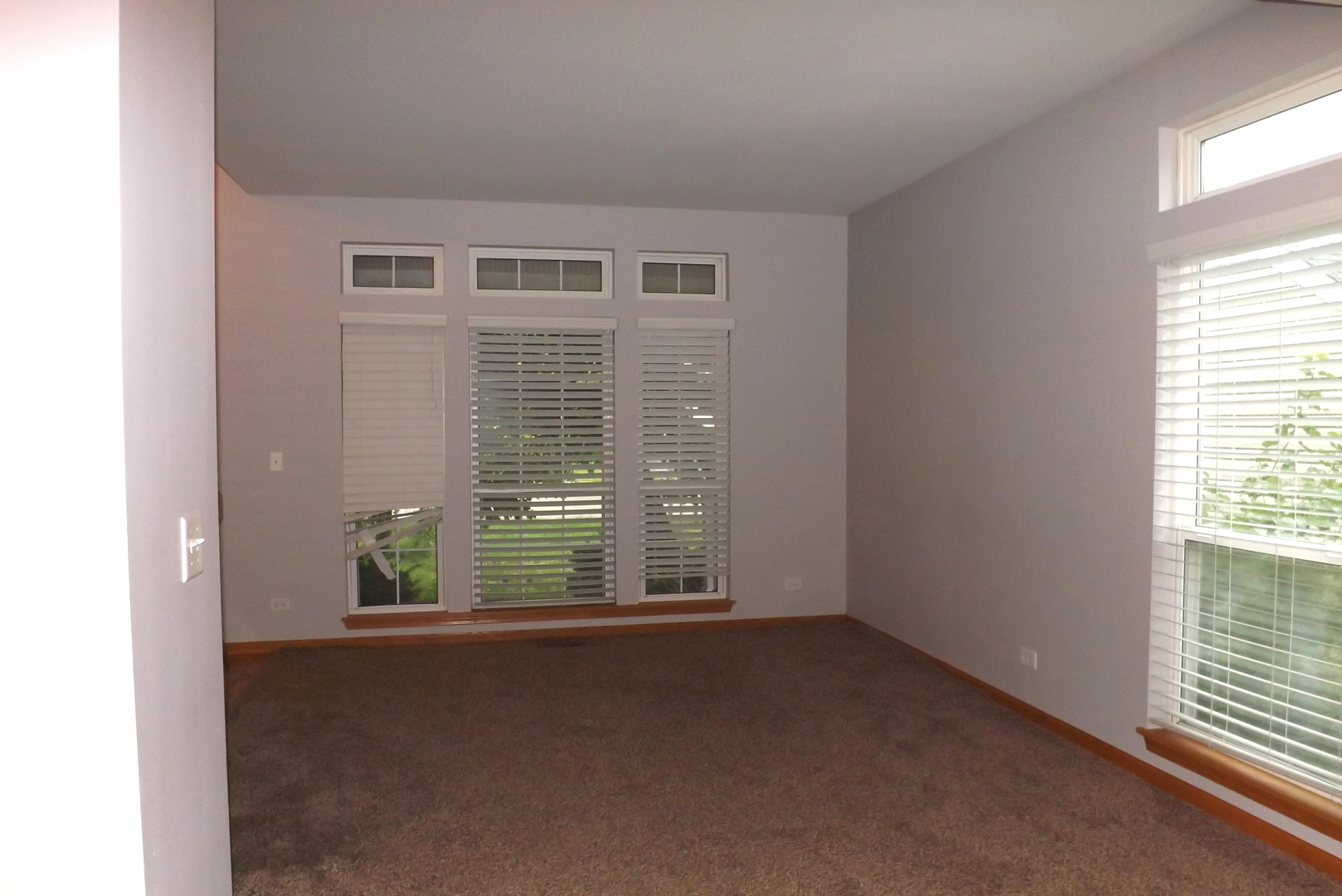 512 West Wildspring Road Round Lake, IL 60073 - Photo 4 of 16 a view of an empty room with a window