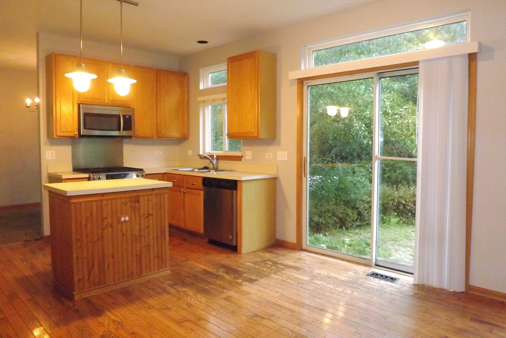 512 West Wildspring Road Round Lake, IL 60073 - Photo 8 of 16 a kitchen with a sink a counter top space and a window