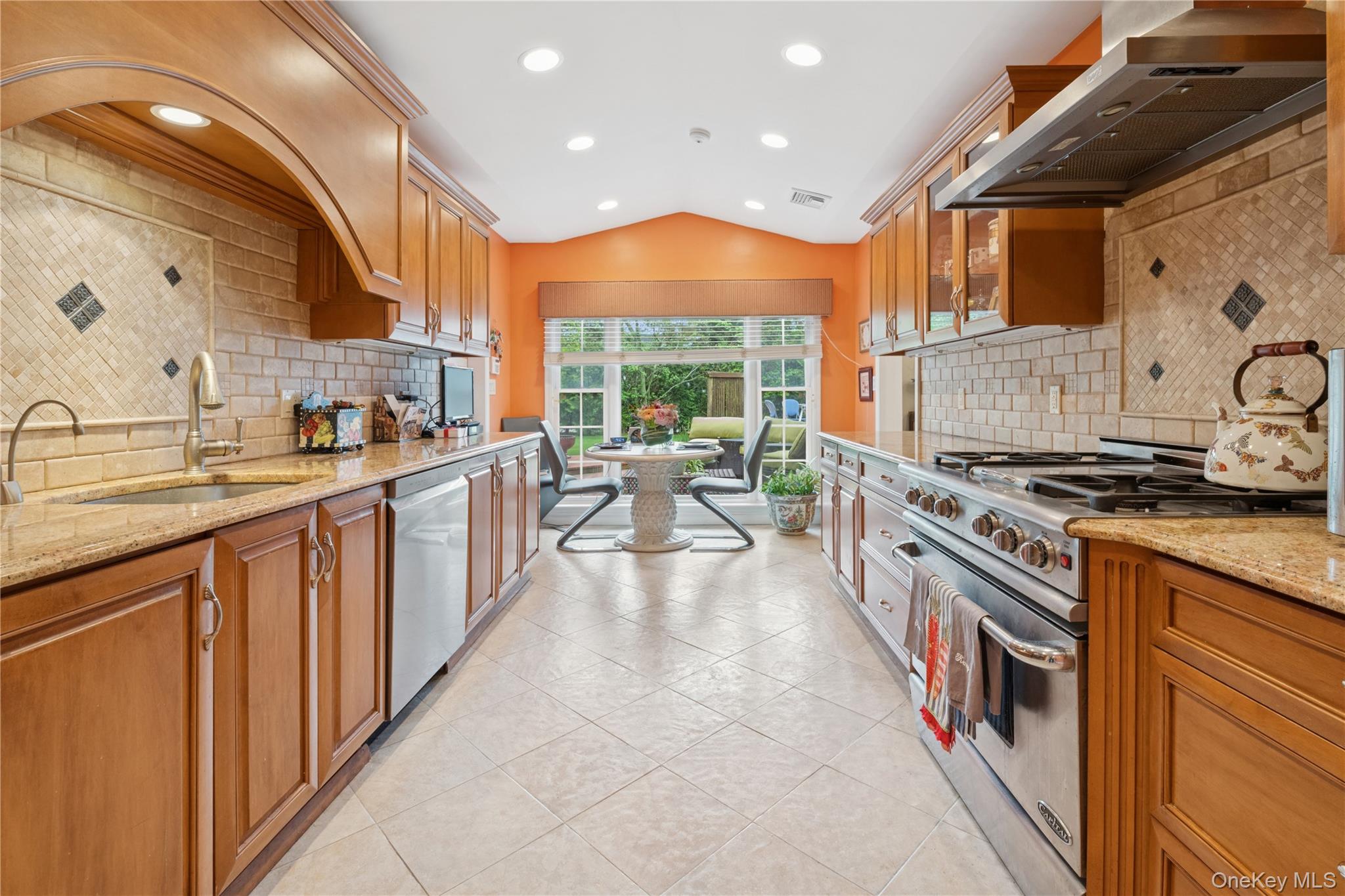 1302 Azure Place Hewlett, NY 11557 - Photo 12 of 32 a kitchen with stainless steel appliances granite countertop a stove and a sink
