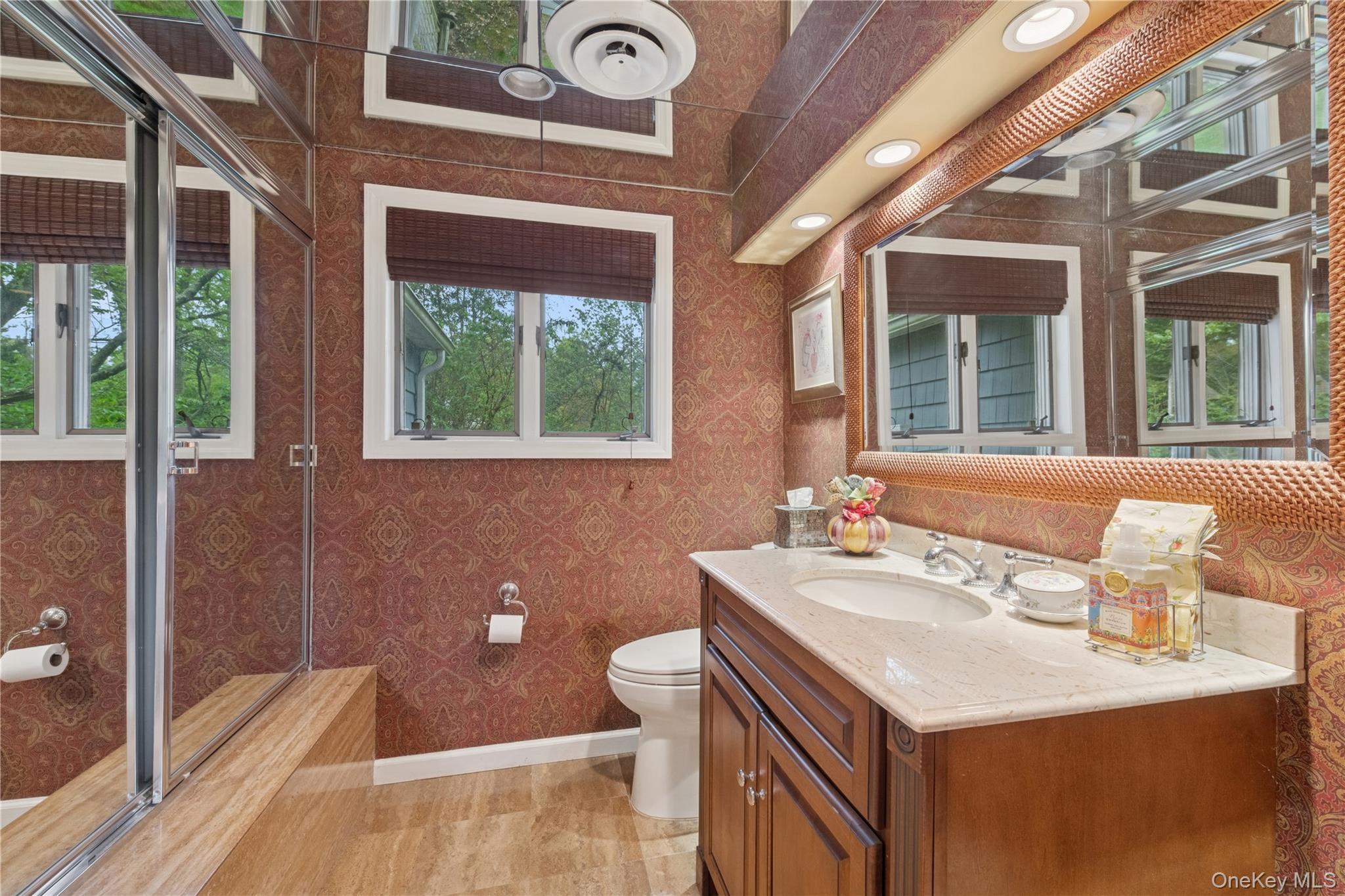 1302 Azure Place Hewlett, NY 11557 - Photo 15 of 32 a bathroom with a sink a toilet and shower