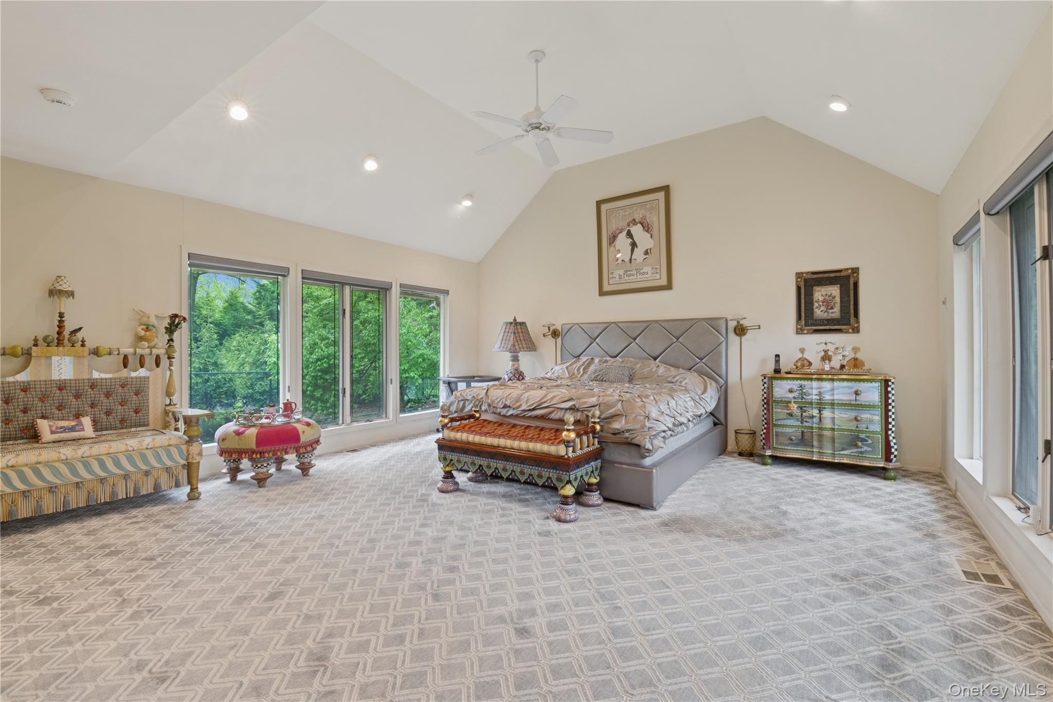 1302 Azure Place Hewlett, NY 11557 - Photo 16 of 32 a spacious bedroom with a bed and a couch