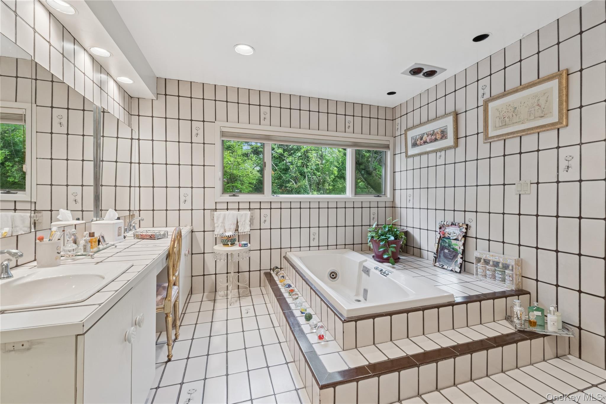 1302 Azure Place Hewlett, NY 11557 - Photo 18 of 32 a bathroom with a sink and a bathtub