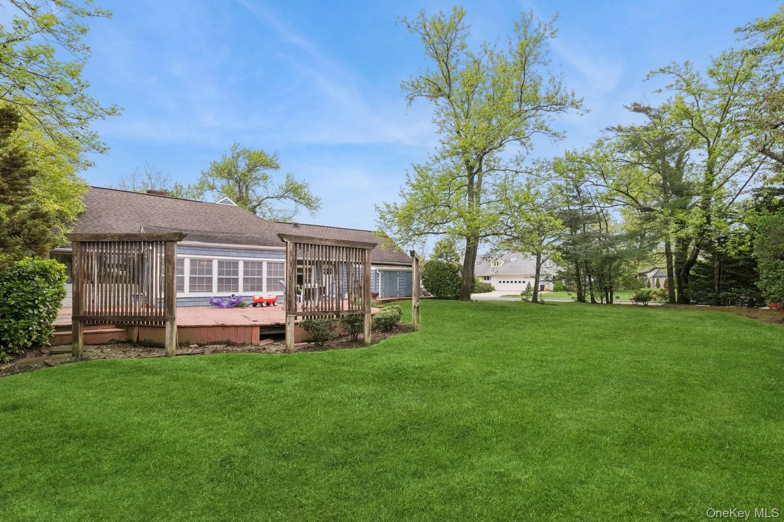 1302 Azure Place Hewlett, NY 11557 - Photo 25 of 32 a front view of house with yard and outdoor seating