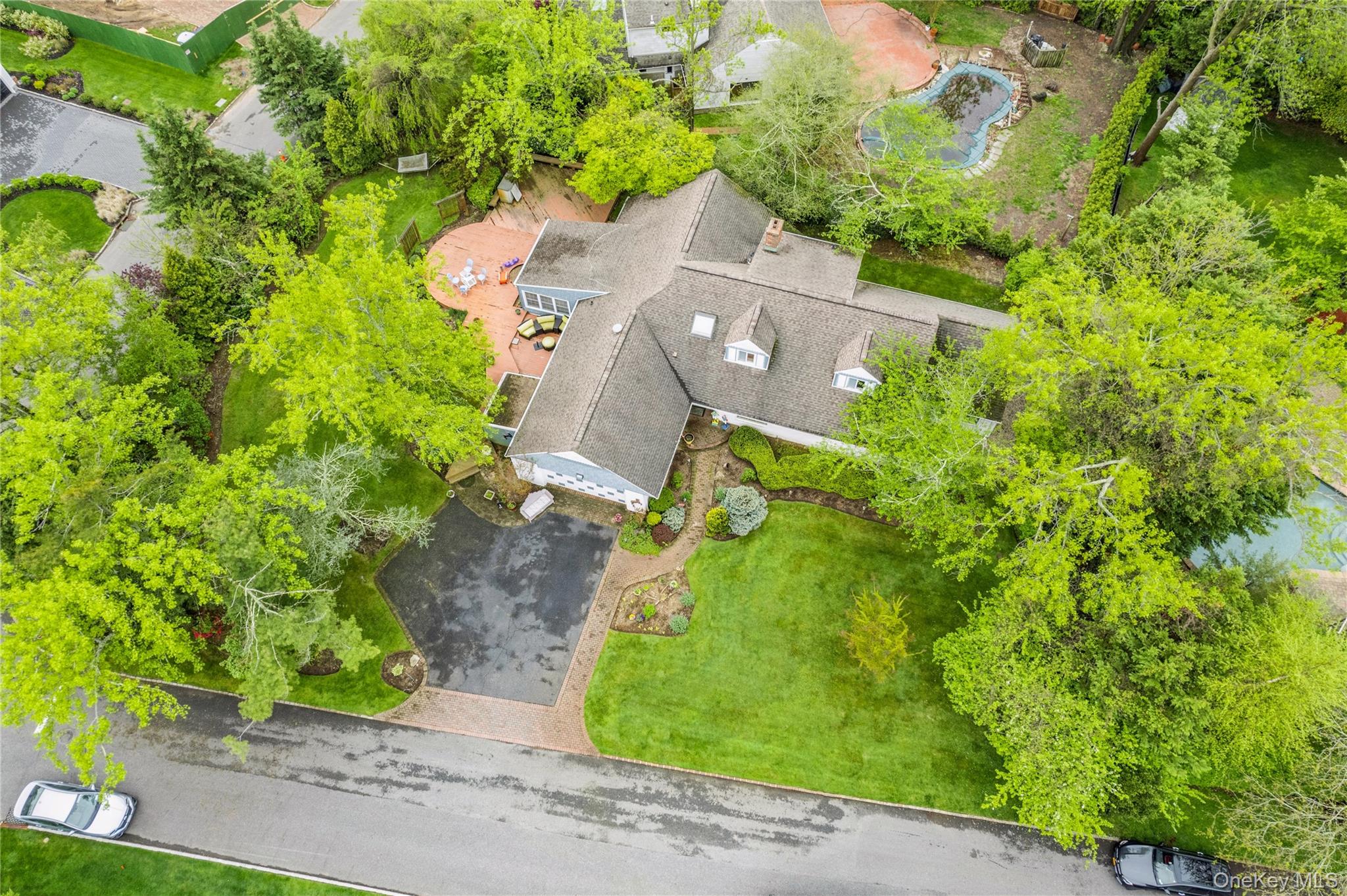 1302 Azure Place Hewlett, NY 11557 - Photo 27 of 32 an aerial view of a house with a yard and garden