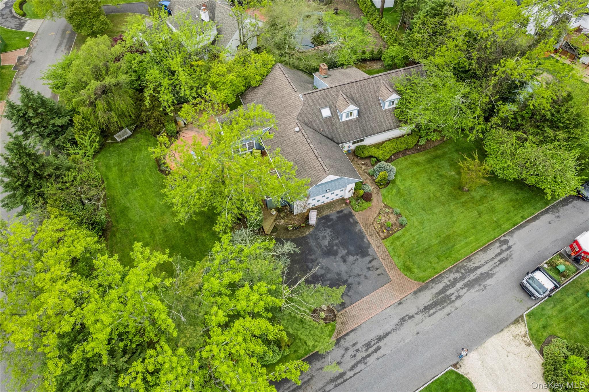 1302 Azure Place Hewlett, NY 11557 - Photo 5 of 32 an aerial view of a house with a yard