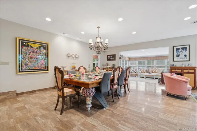 a dining room with furniture a rug and wooden floor