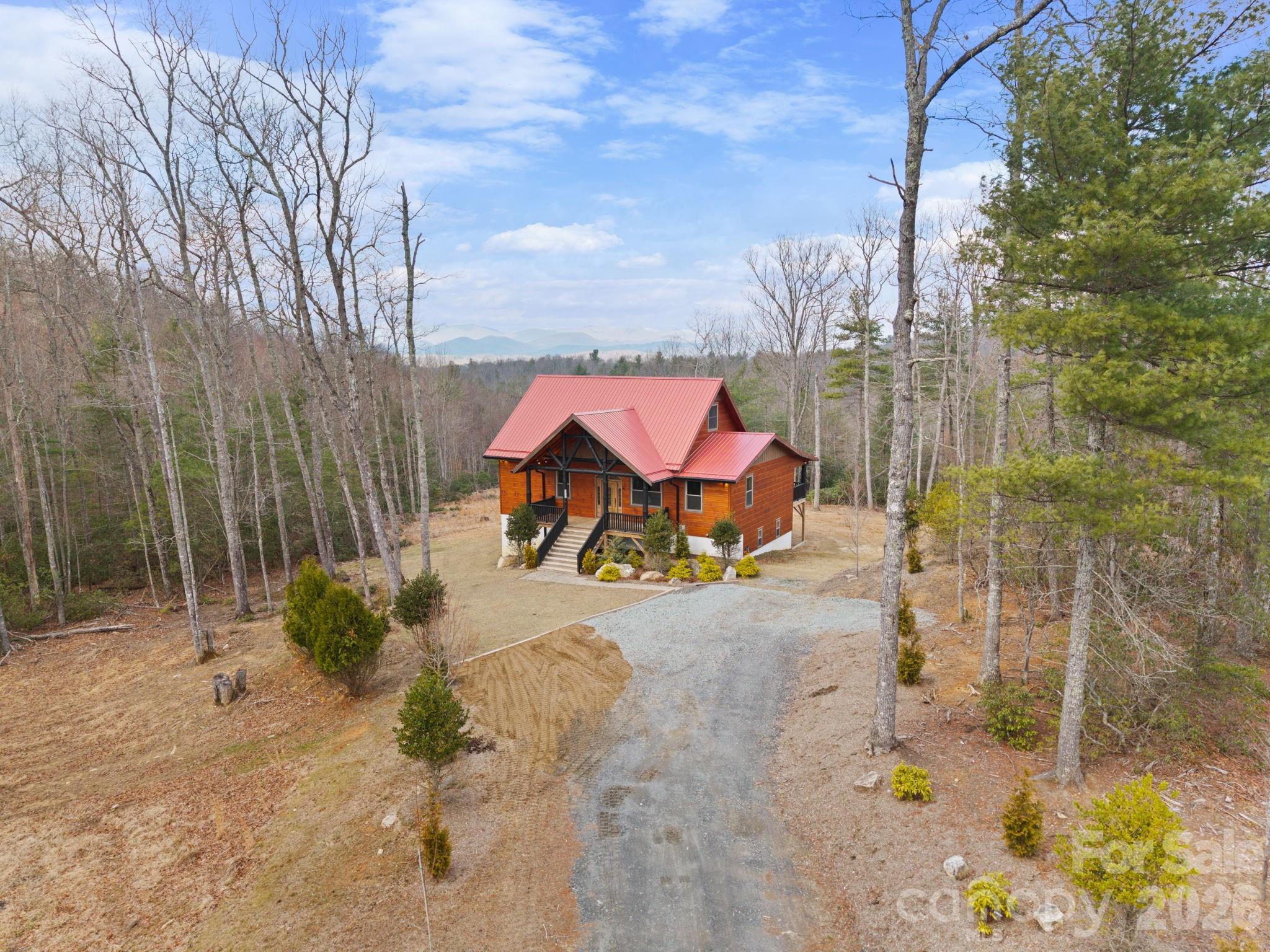 449 Hampton Ridge Road Fleetwood, NC 28626 - Photo 2 of 48 a view of outdoor space and garden