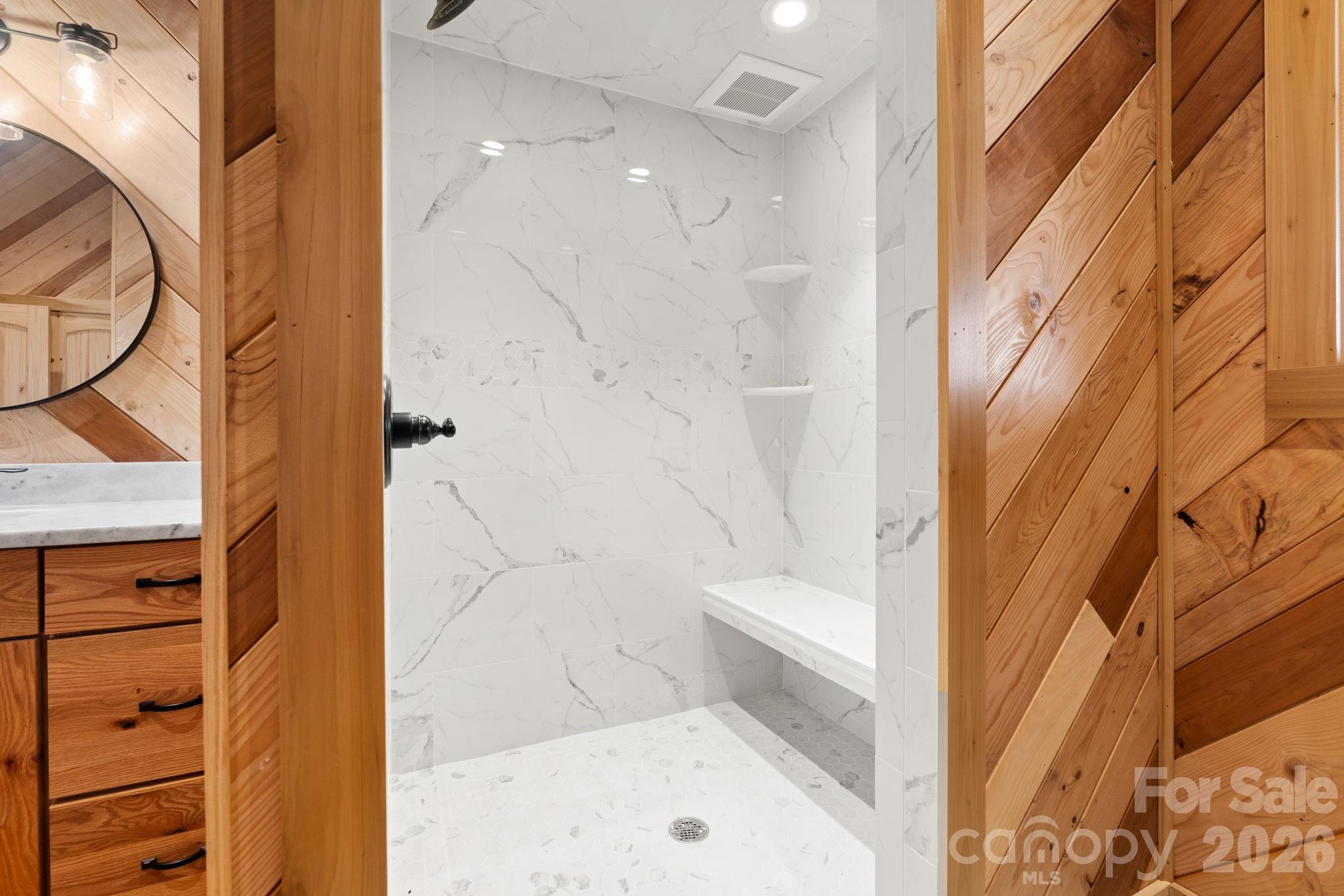 449 Hampton Ridge Road Fleetwood, NC 28626 - Photo 21 of 48 a bathroom with a bathtub and a shower