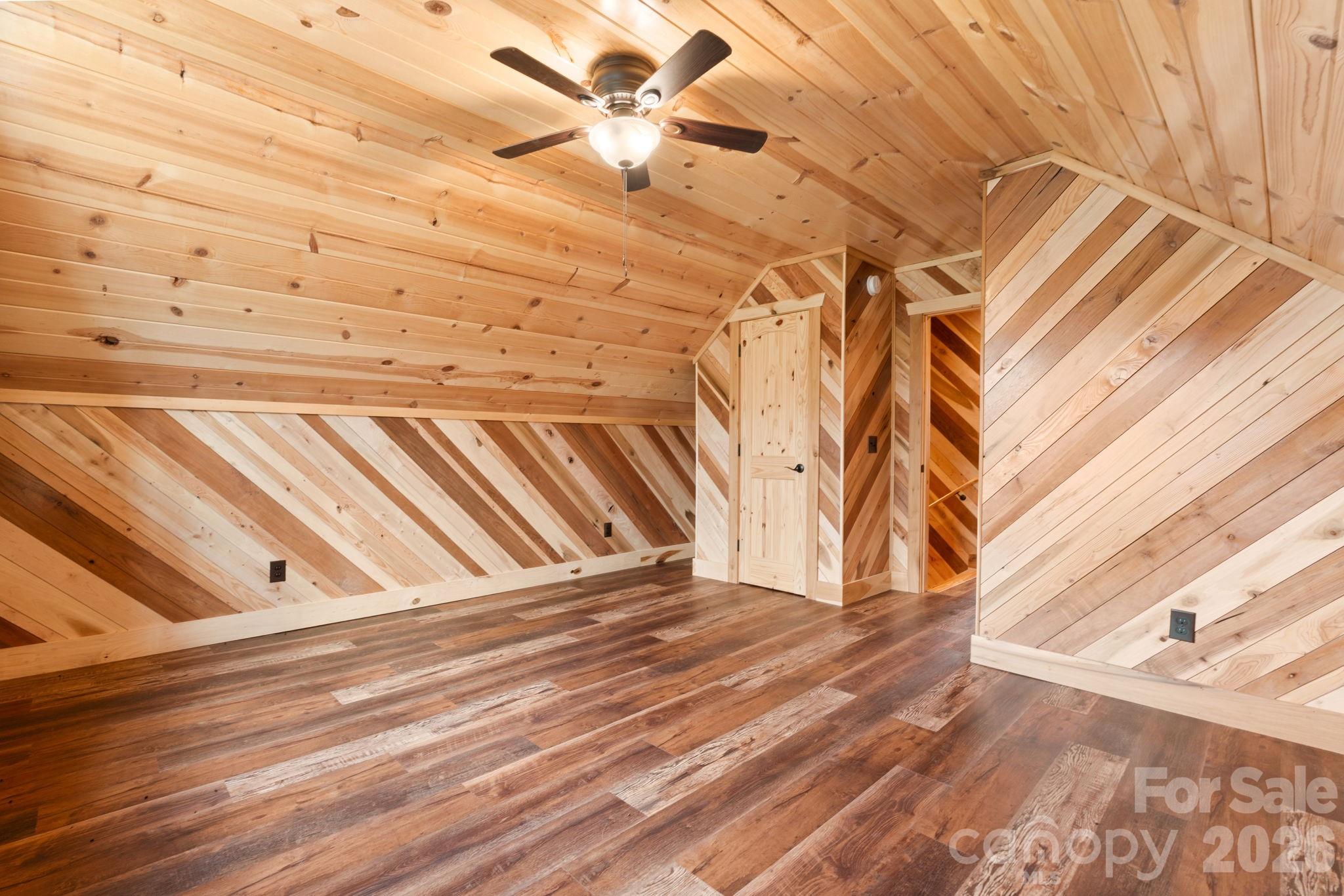 449 Hampton Ridge Road Fleetwood, NC 28626 - Photo 28 of 48 a view of a room with stairs and a white wall