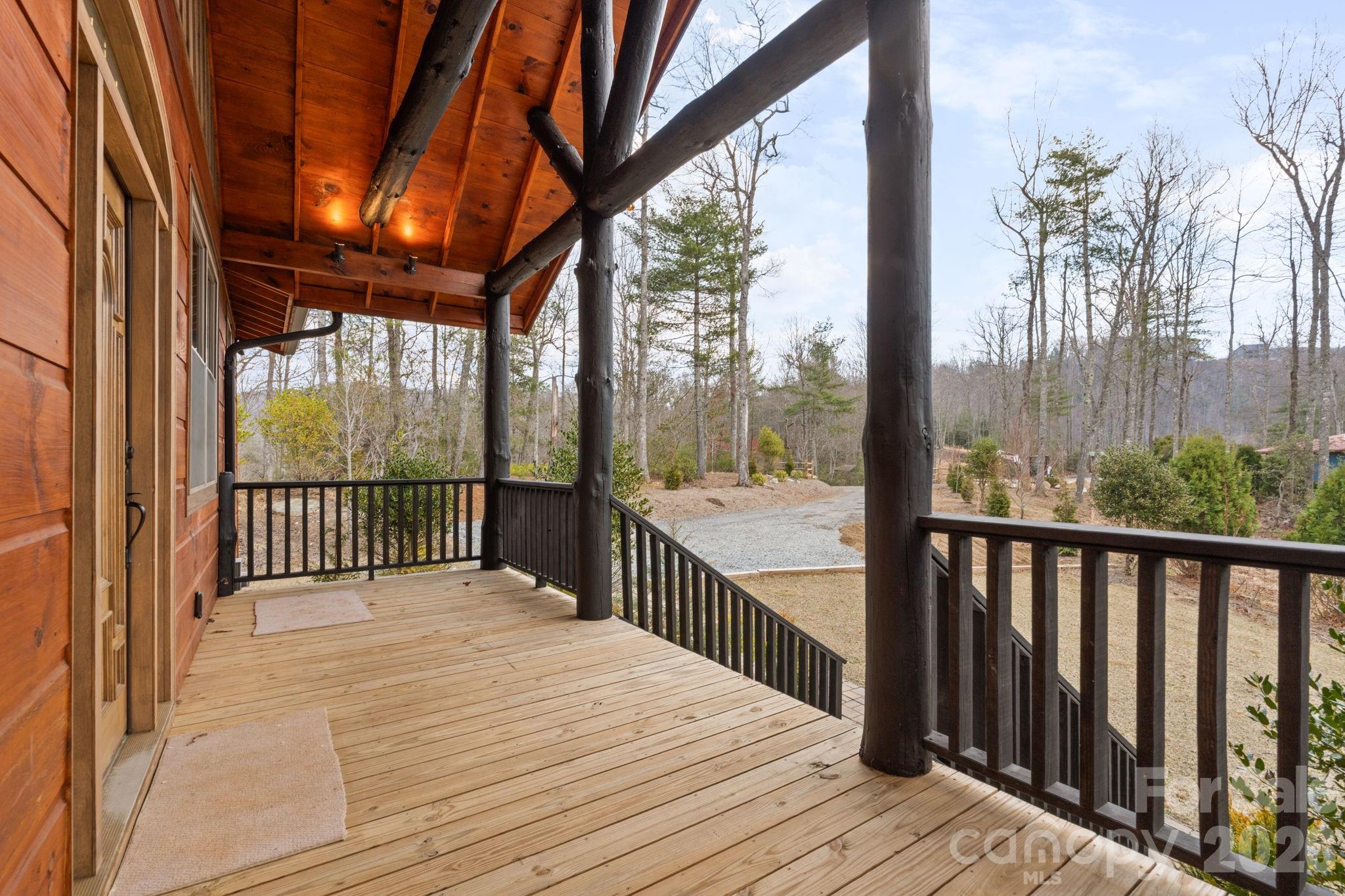 449 Hampton Ridge Road Fleetwood, NC 28626 - Photo 3 of 48 a balcony with view of wooden floor