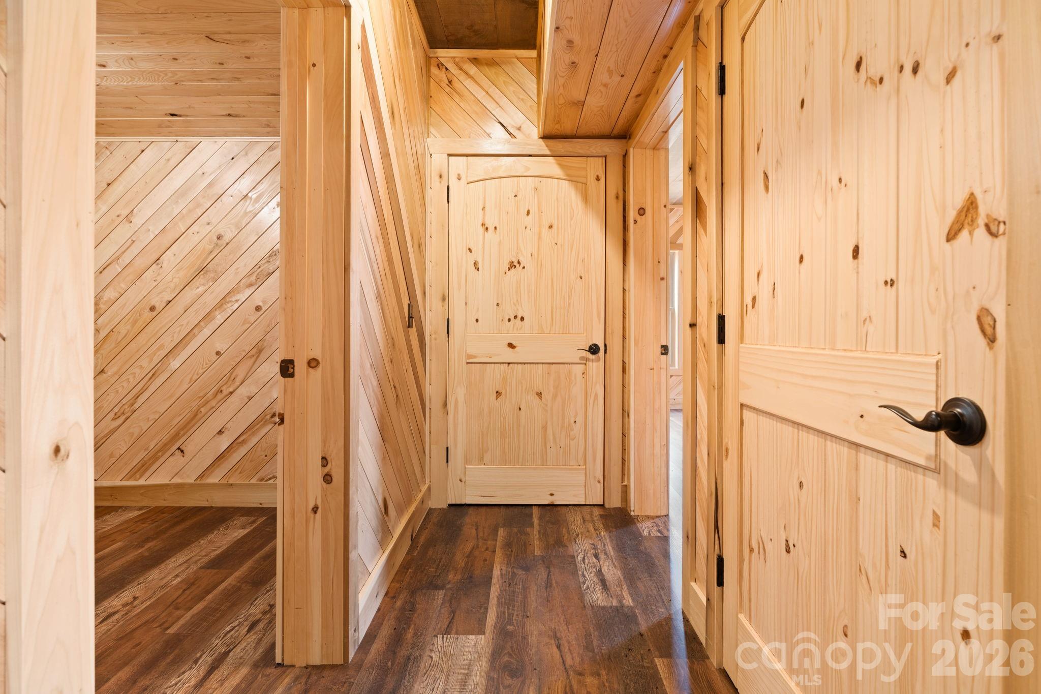 449 Hampton Ridge Road Fleetwood, NC 28626 - Photo 35 of 48 a view of a hallway with wooden floor and staircase