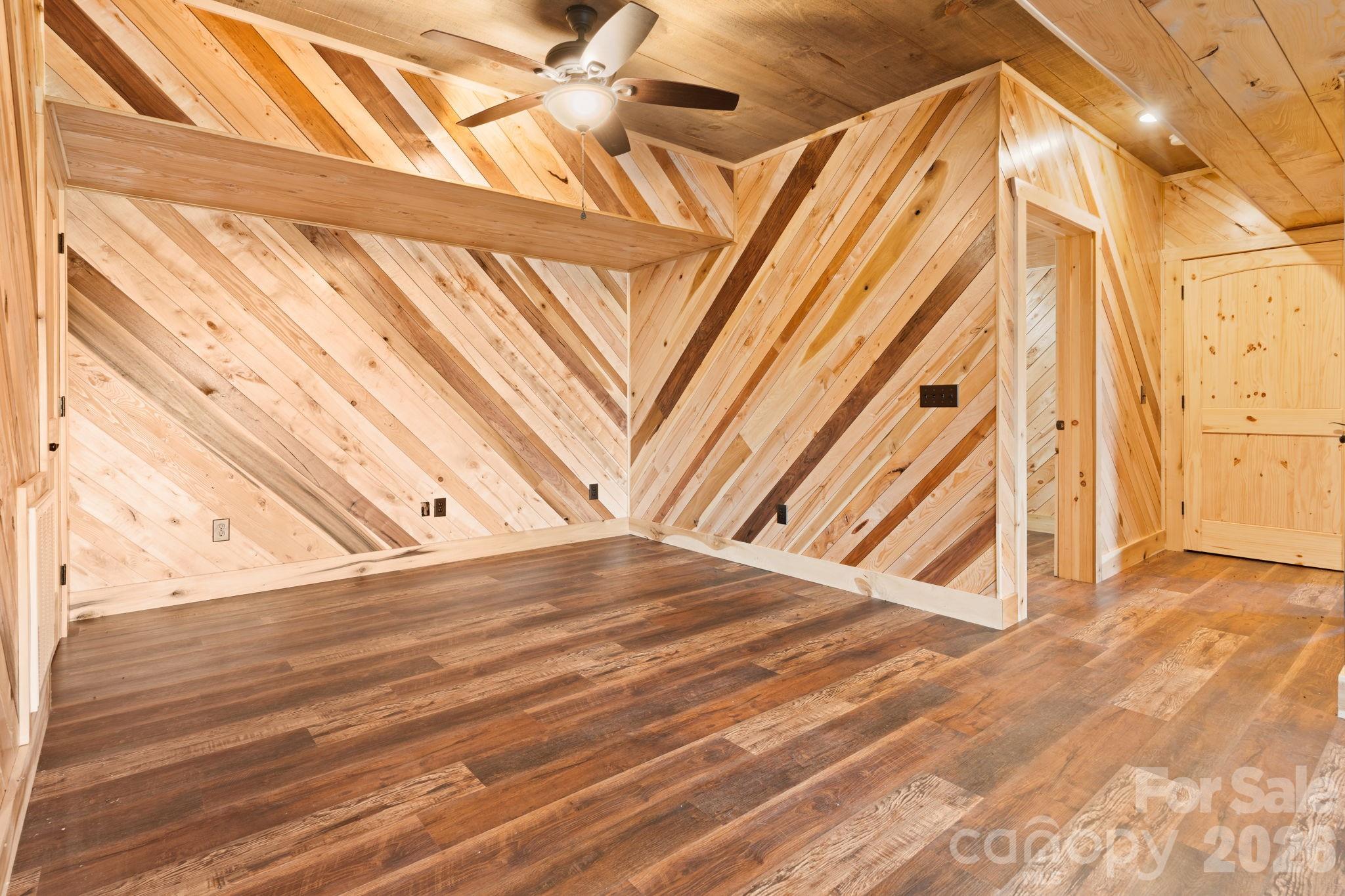 449 Hampton Ridge Road Fleetwood, NC 28626 - Photo 36 of 48 a view of a room with wooden floor