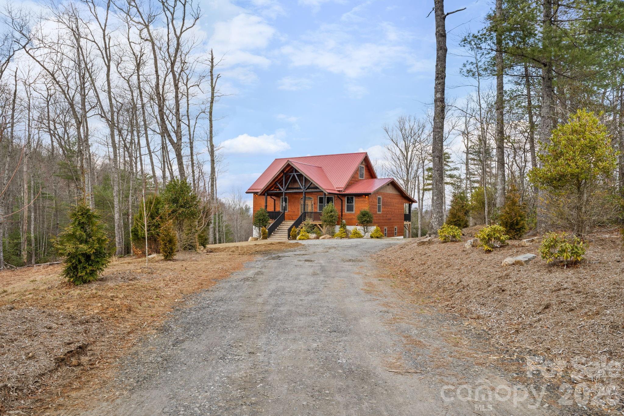 449 Hampton Ridge Road Fleetwood, NC 28626 - Photo 46 of 48 a view of an outdoor space with trees