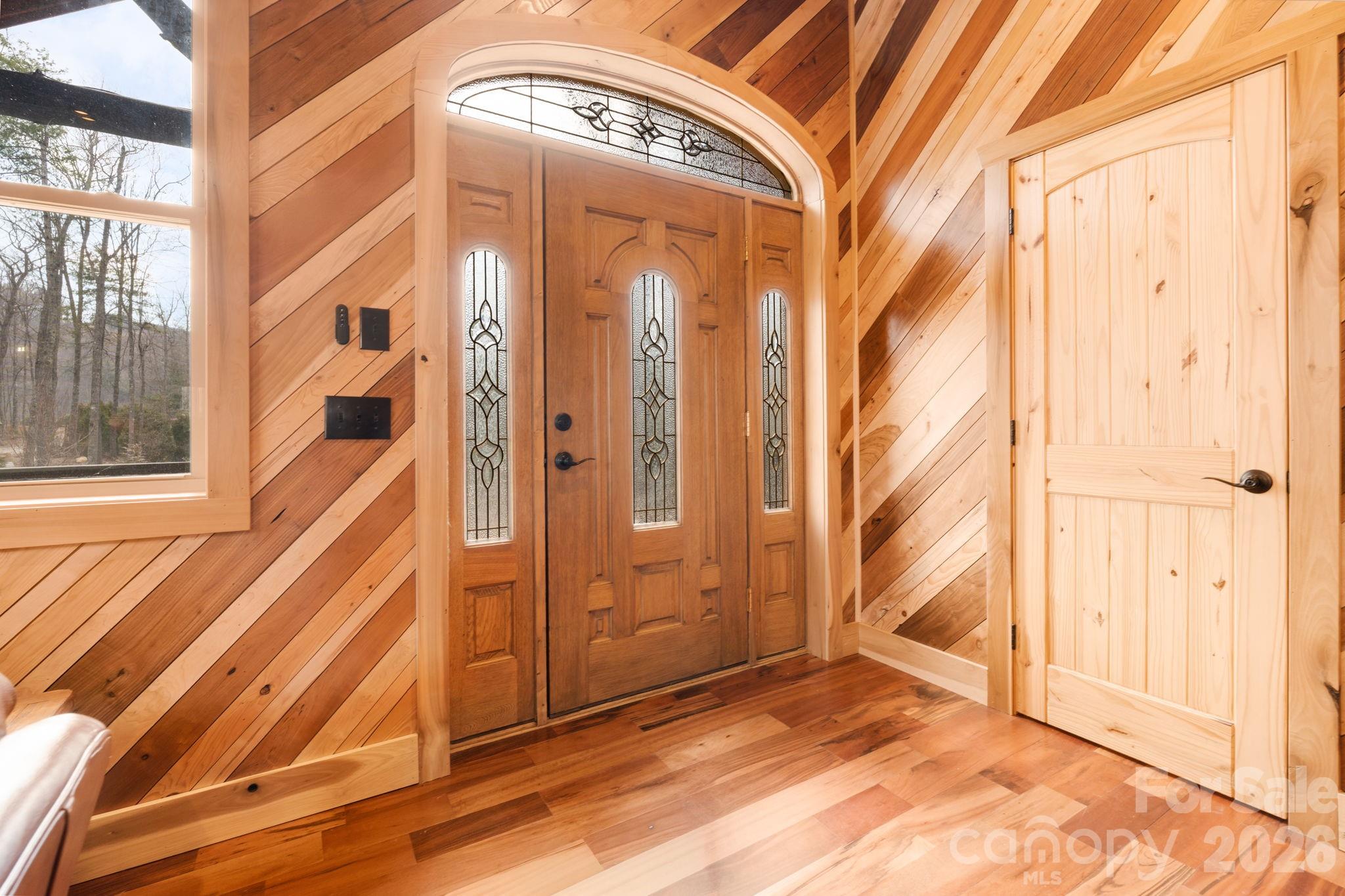 449 Hampton Ridge Road Fleetwood, NC 28626 - Photo 5 of 48 a view of a entryway door of the house