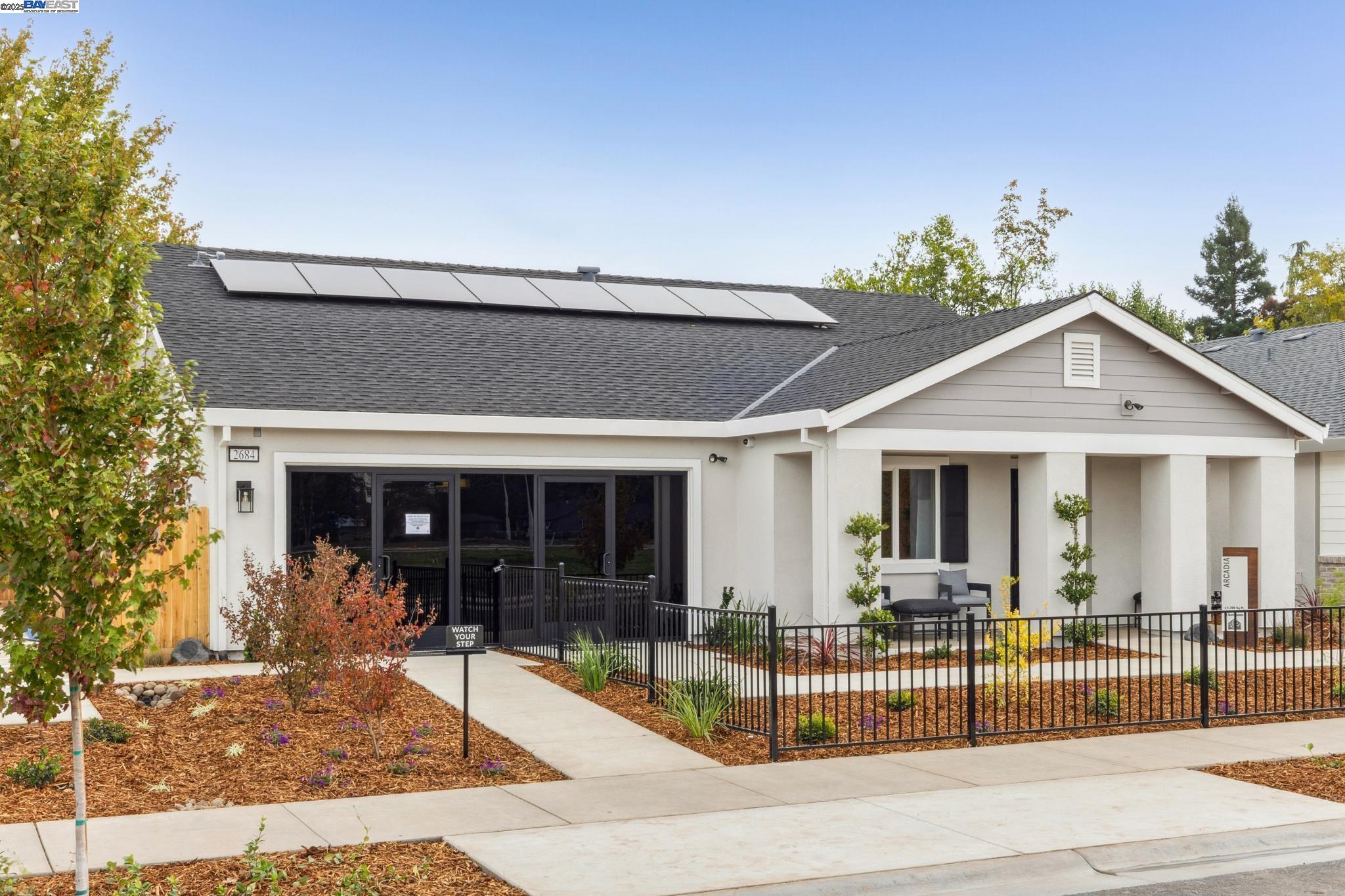 a view of a house with entrance gate