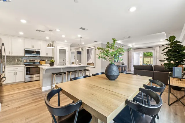 a kitchen with a table and chairs in it