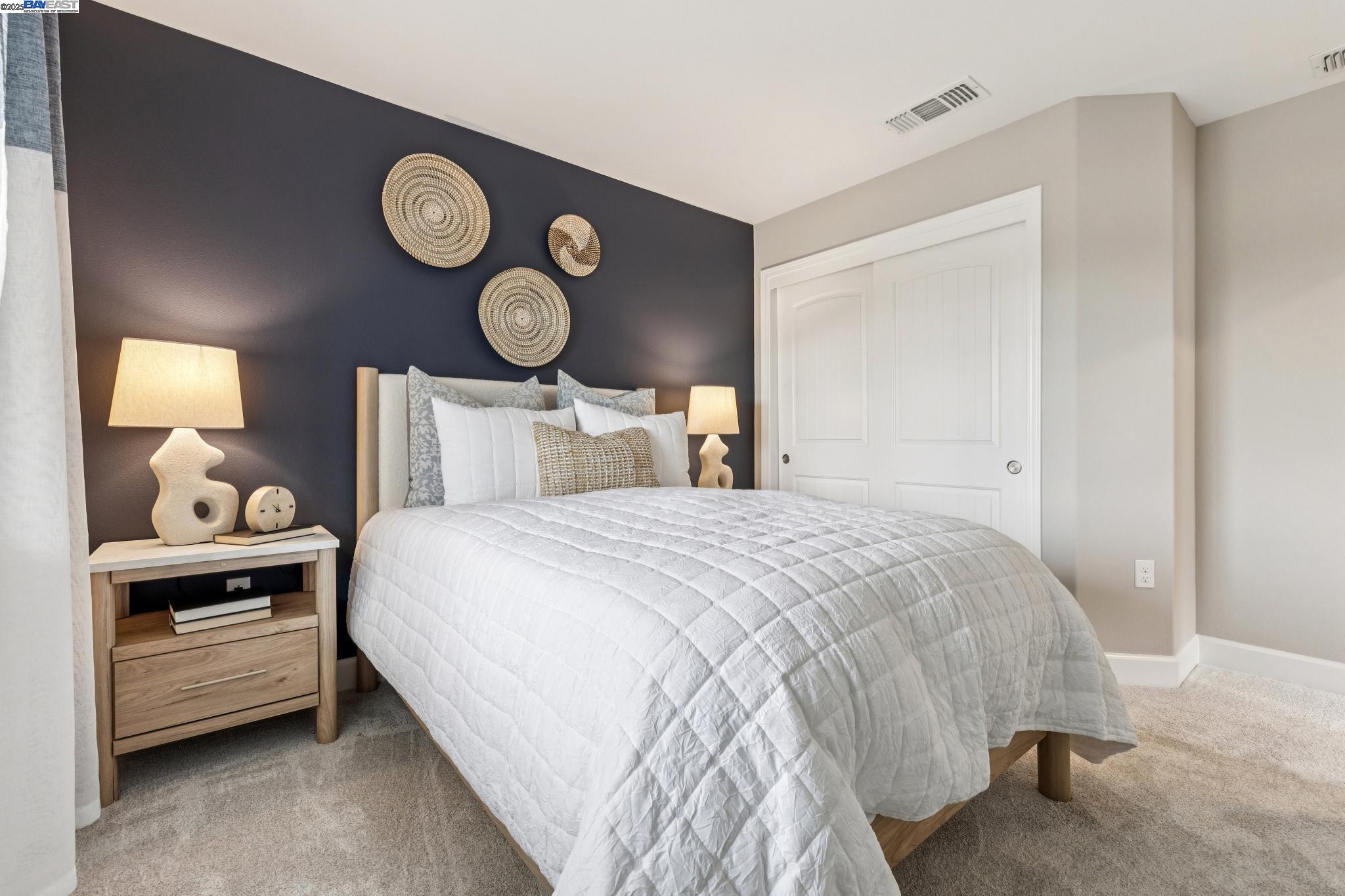 2652 Wesley Way Chico, CA 95973 - Photo 33 of 45 a bedroom with a bed and a lamp on dresser