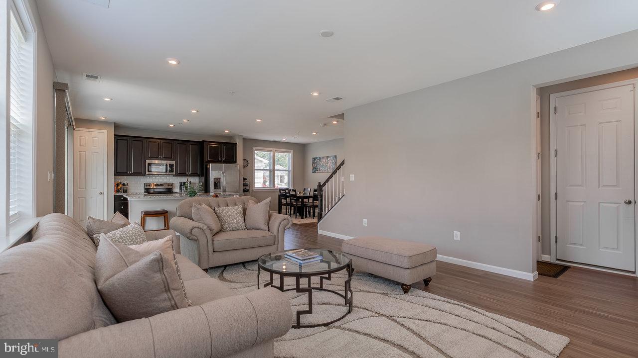 12610 Rosencrans Dr. Hagerstown, MD 21740 - Photo 13 of 49 a living room with furniture and a wooden floor