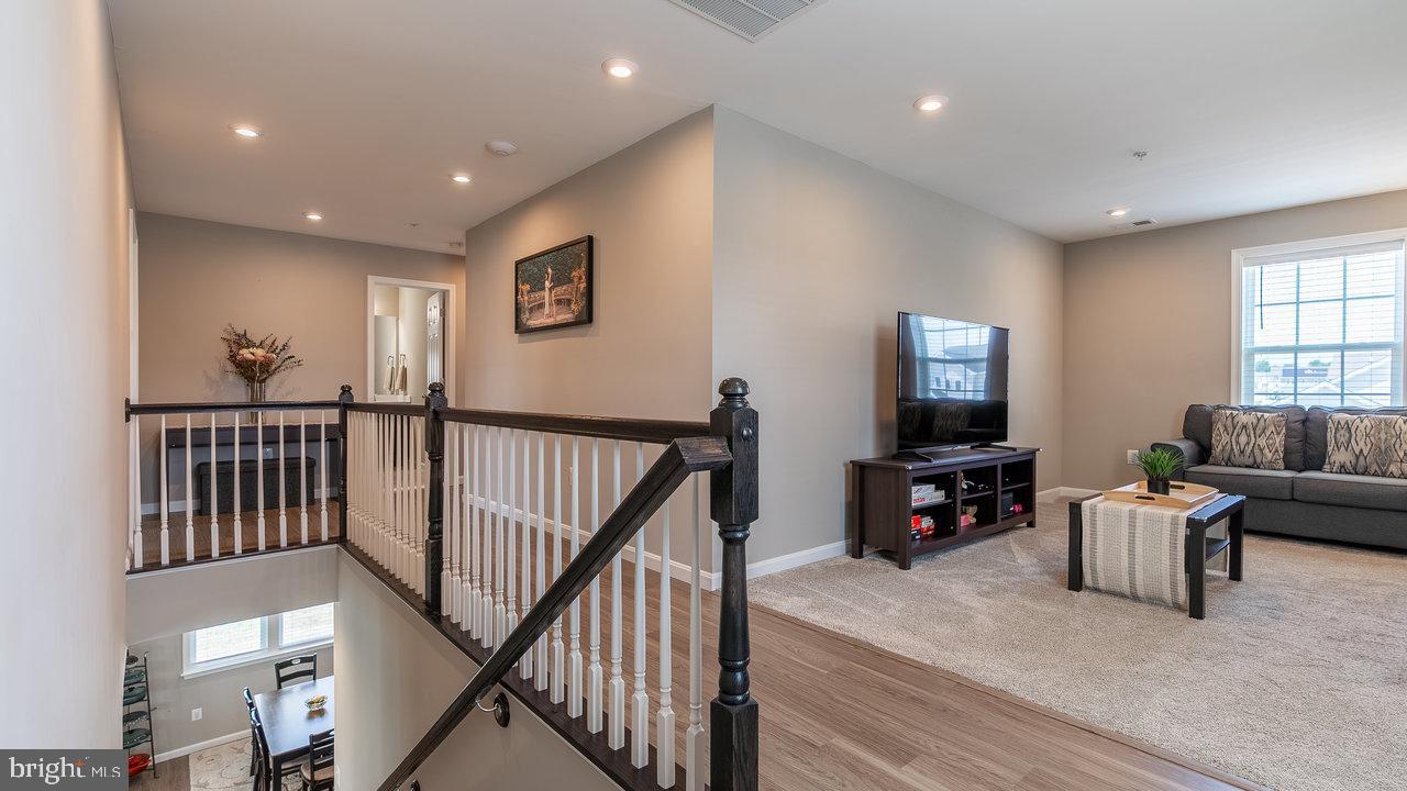 12610 Rosencrans Dr. Hagerstown, MD 21740 - Photo 19 of 49 a living room with furniture and a flat screen tv
