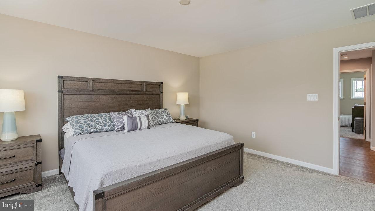 12610 Rosencrans Dr. Hagerstown, MD 21740 - Photo 26 of 49 a bed room with a bed and a night stand