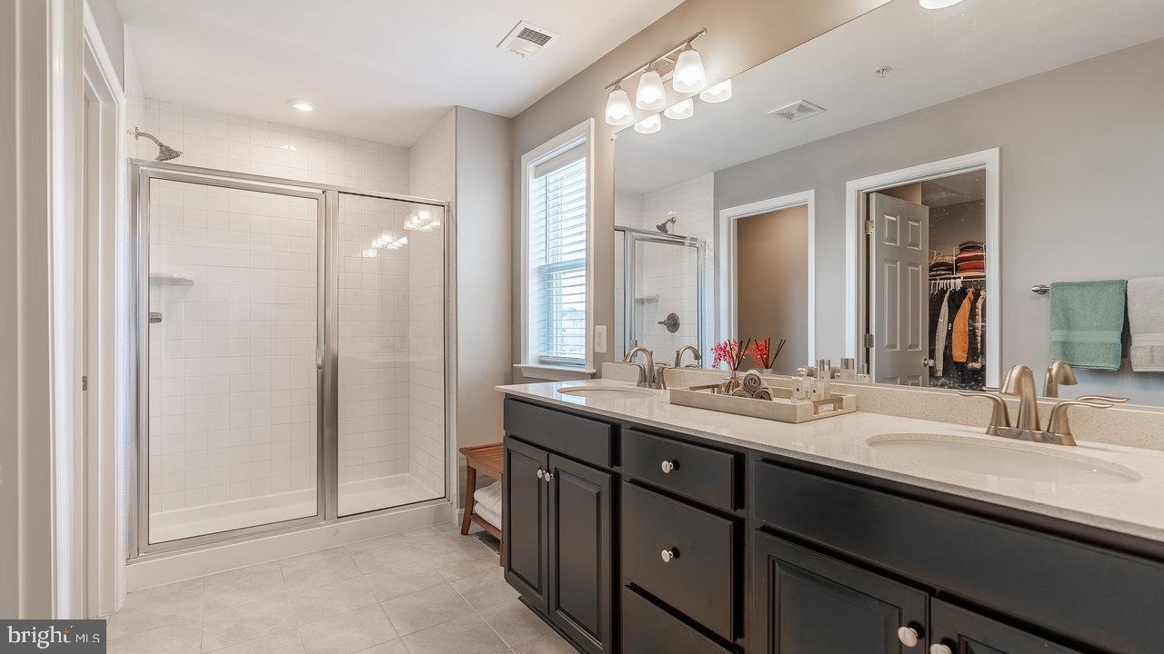 12610 Rosencrans Dr. Hagerstown, MD 21740 - Photo 28 of 49 a bathroom with double sink and a mirror