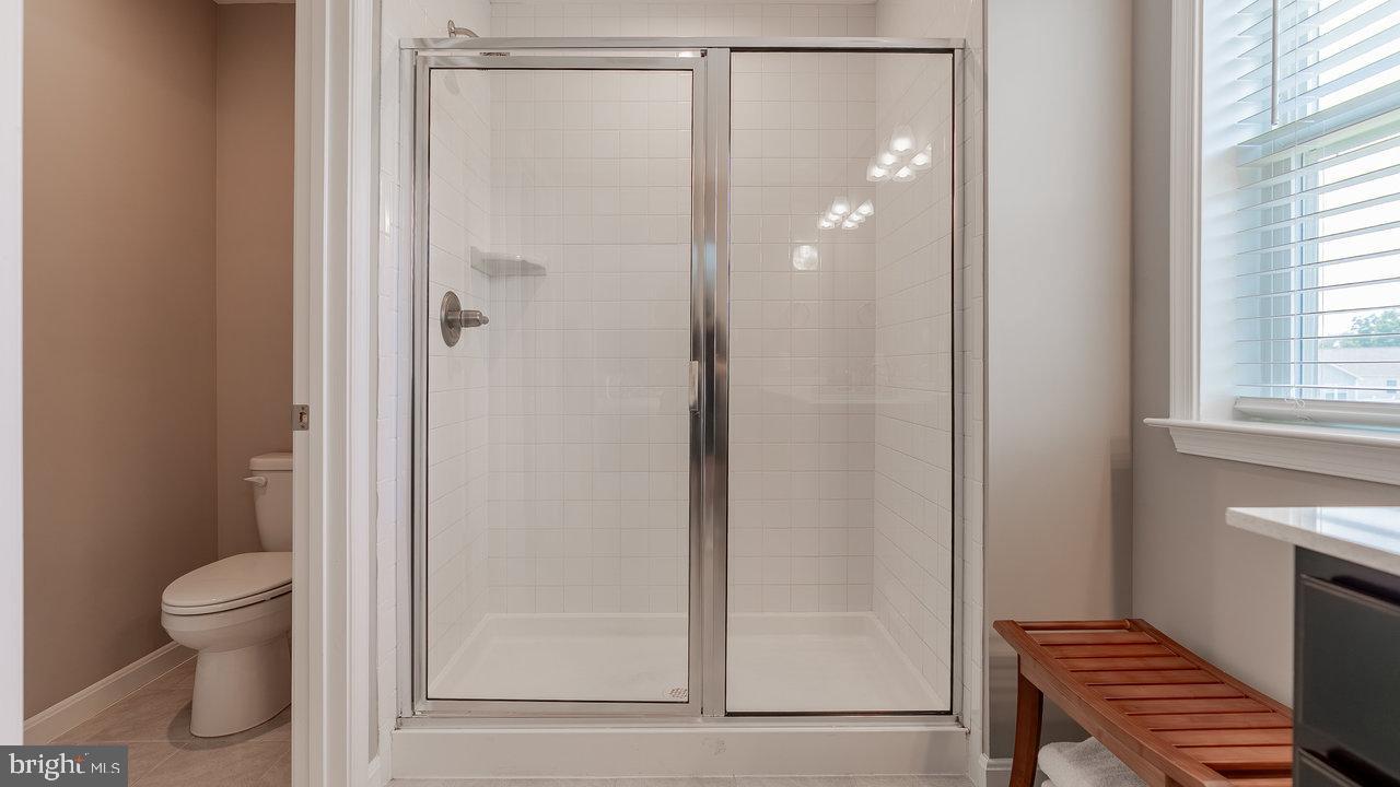 12610 Rosencrans Dr. Hagerstown, MD 21740 - Photo 29 of 49 a bathroom with a shower and a toilet