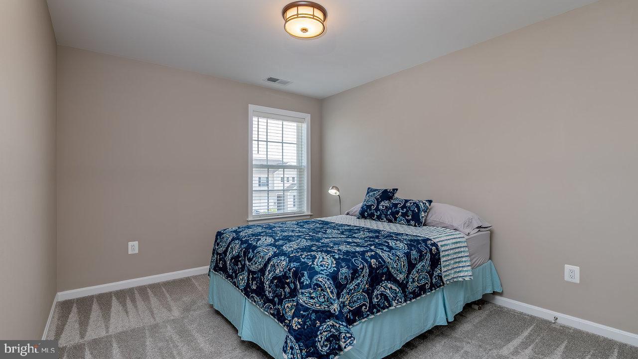 12610 Rosencrans Dr. Hagerstown, MD 21740 - Photo 35 of 49 a bedroom with a bed and window