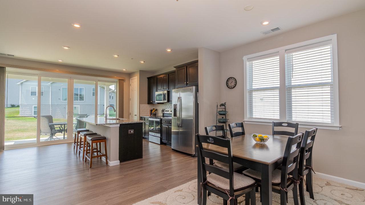 12610 Rosencrans Dr. Hagerstown, MD 21740 - Photo 41 of 49 a view of a a dining room with furniture window and wooden floor