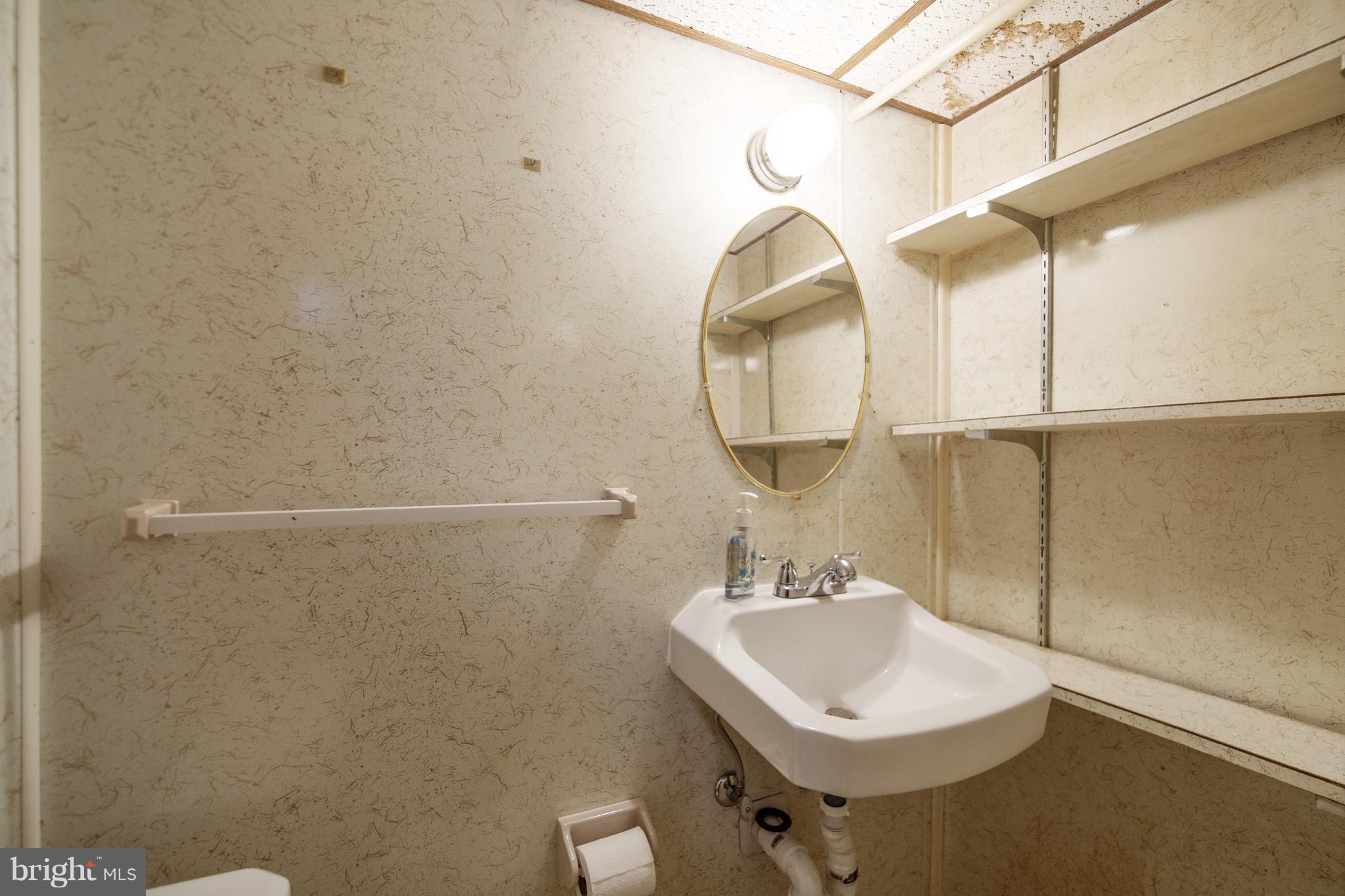 1031 Elm Road Baltimore, MD 21227 - Photo 12 of 25 Basement Half Bath