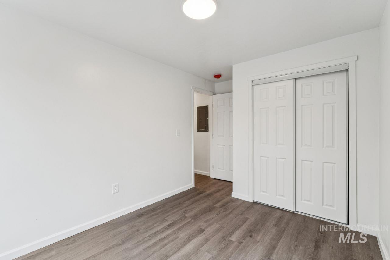 911 2nd Street South Nampa, ID 83651 - Photo 17 of 50 Unfurnished bedroom with wood finished floors, a closet, and electric panel