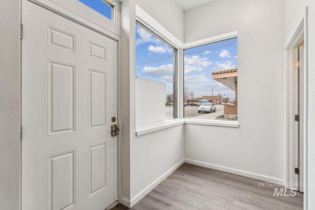 911 2nd Street South Nampa, ID 83651 - Photo 7 of 50 Doorway to outside with wood finished floors and baseboards