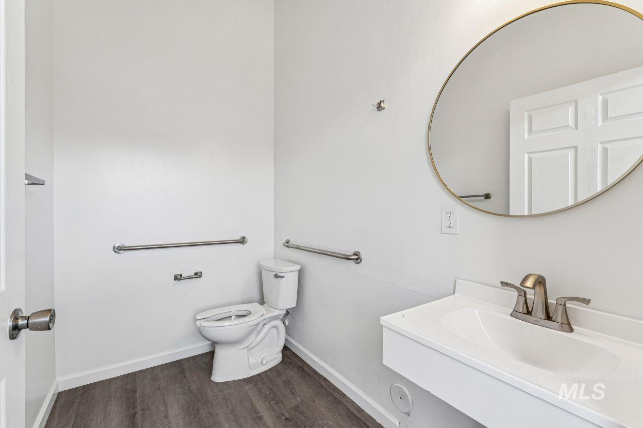 911 2nd Street South Nampa, ID 83651 - Photo 9 of 50 Bathroom featuring dark wood-style flooring and vanity