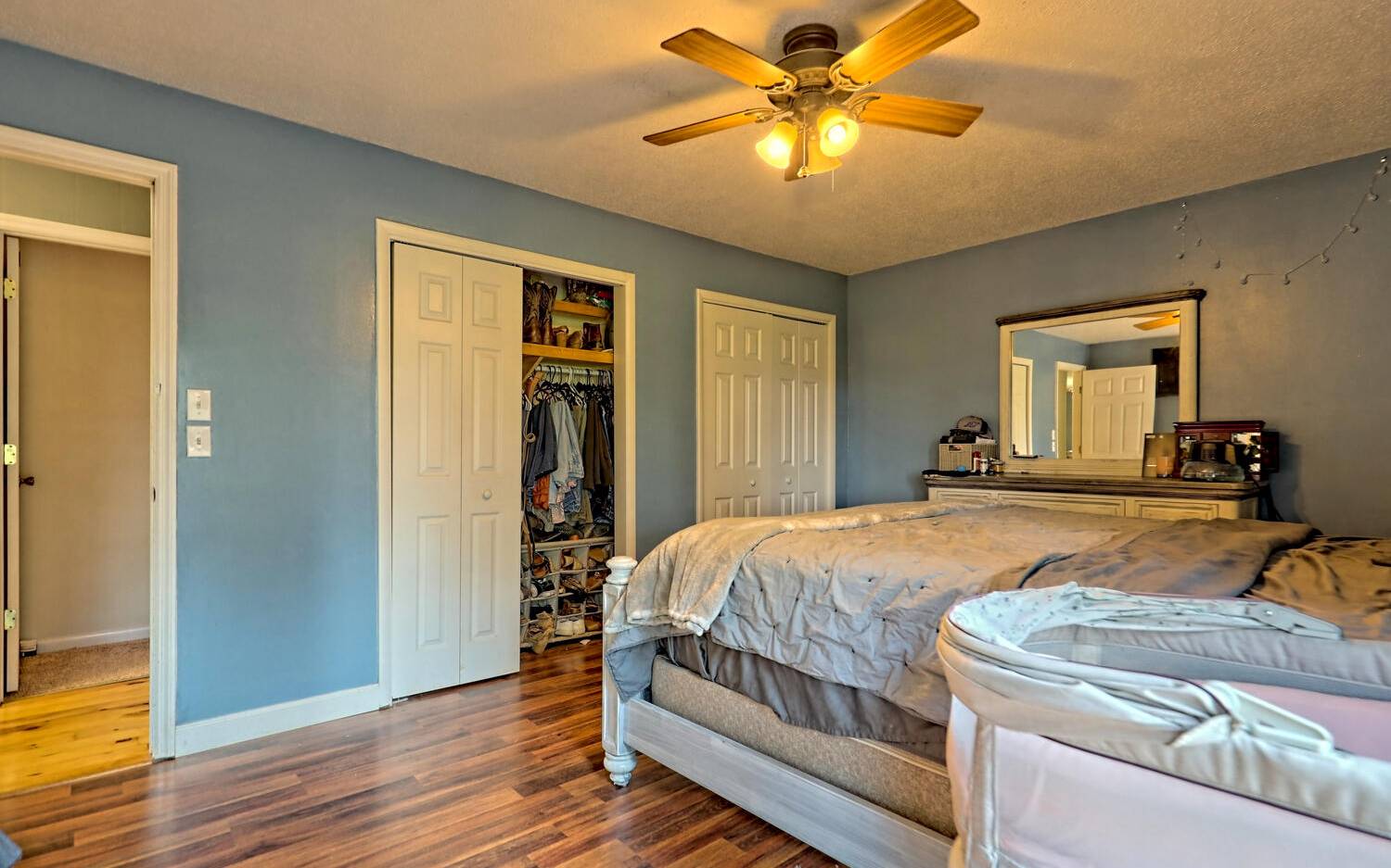 760 Panther Top Road Murphy, NC 28906 - Photo 26 of 45 a bedroom with a bed and a chandelier