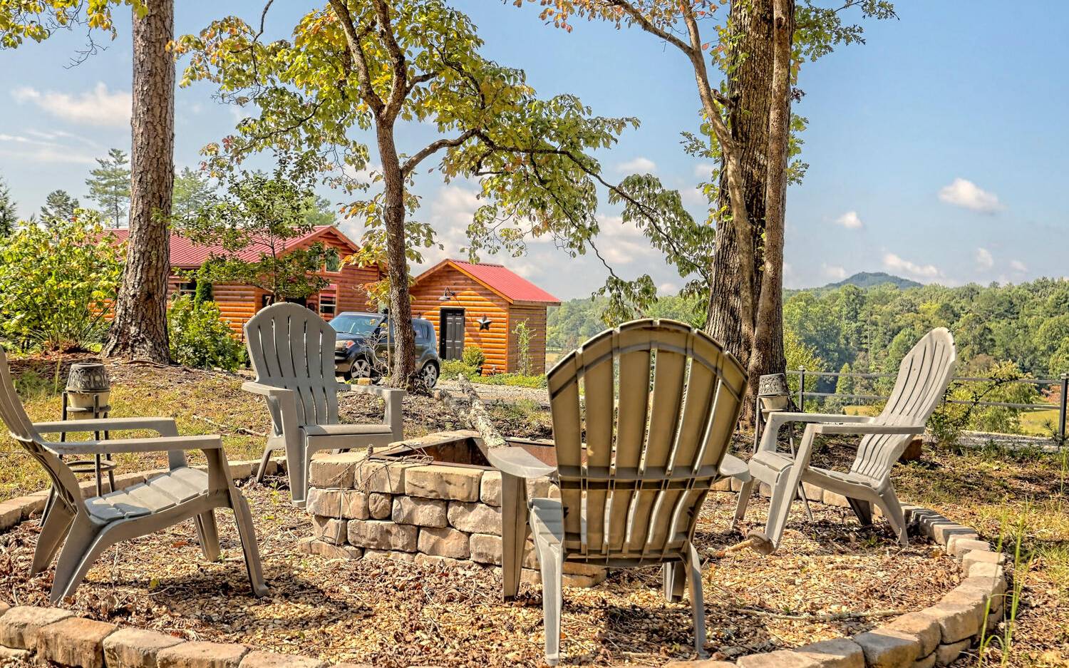 760 Panther Top Road Murphy, NC 28906 - Photo 39 of 45 a patio with table and chairs and potted plants