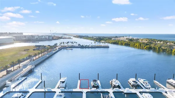 a view of a terrace with lawn chairs