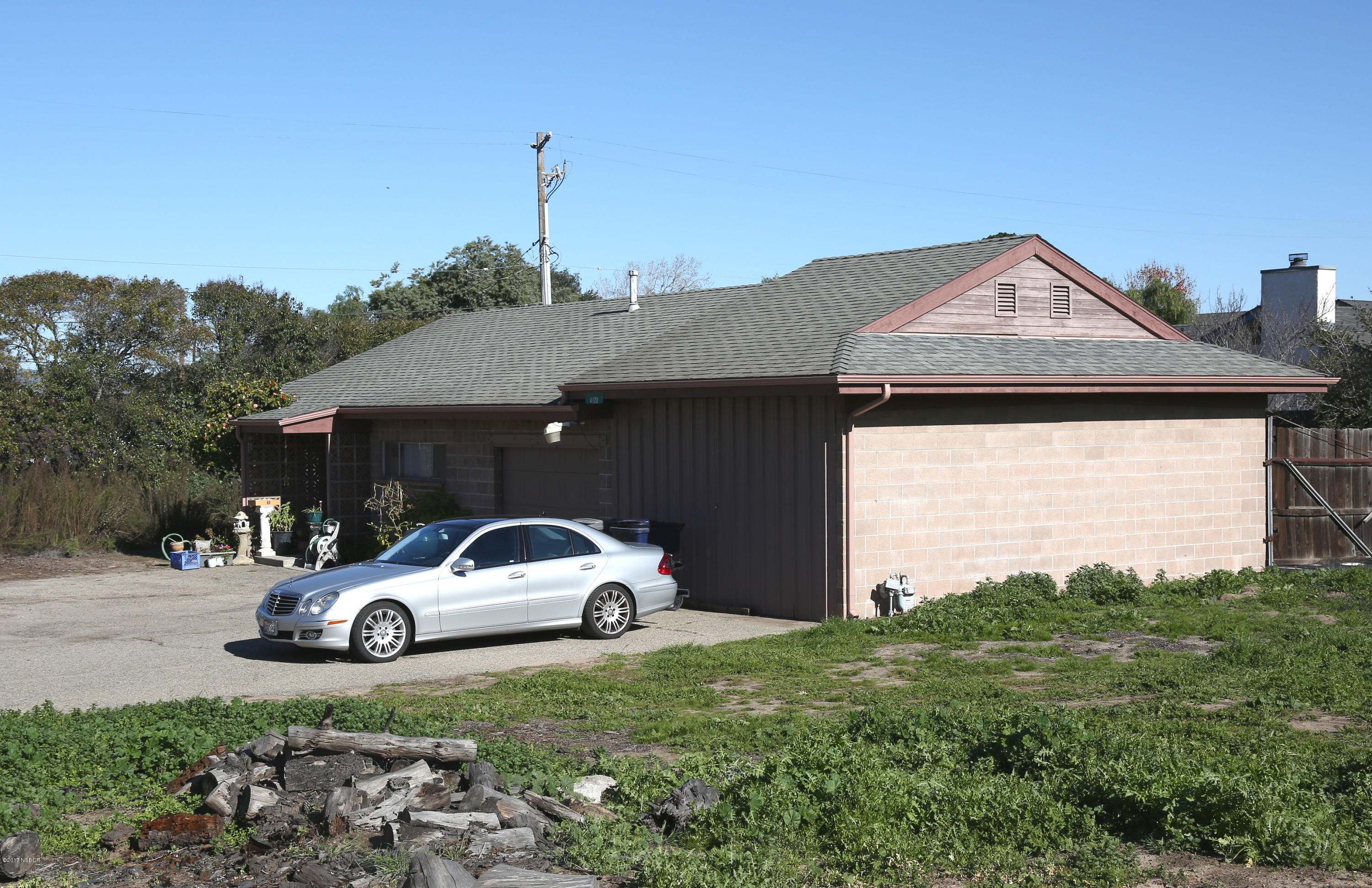 4128 Orcutt Road Santa Maria, CA 93455 - Photo 1 of 1 a car parked in front of a house with a small yard