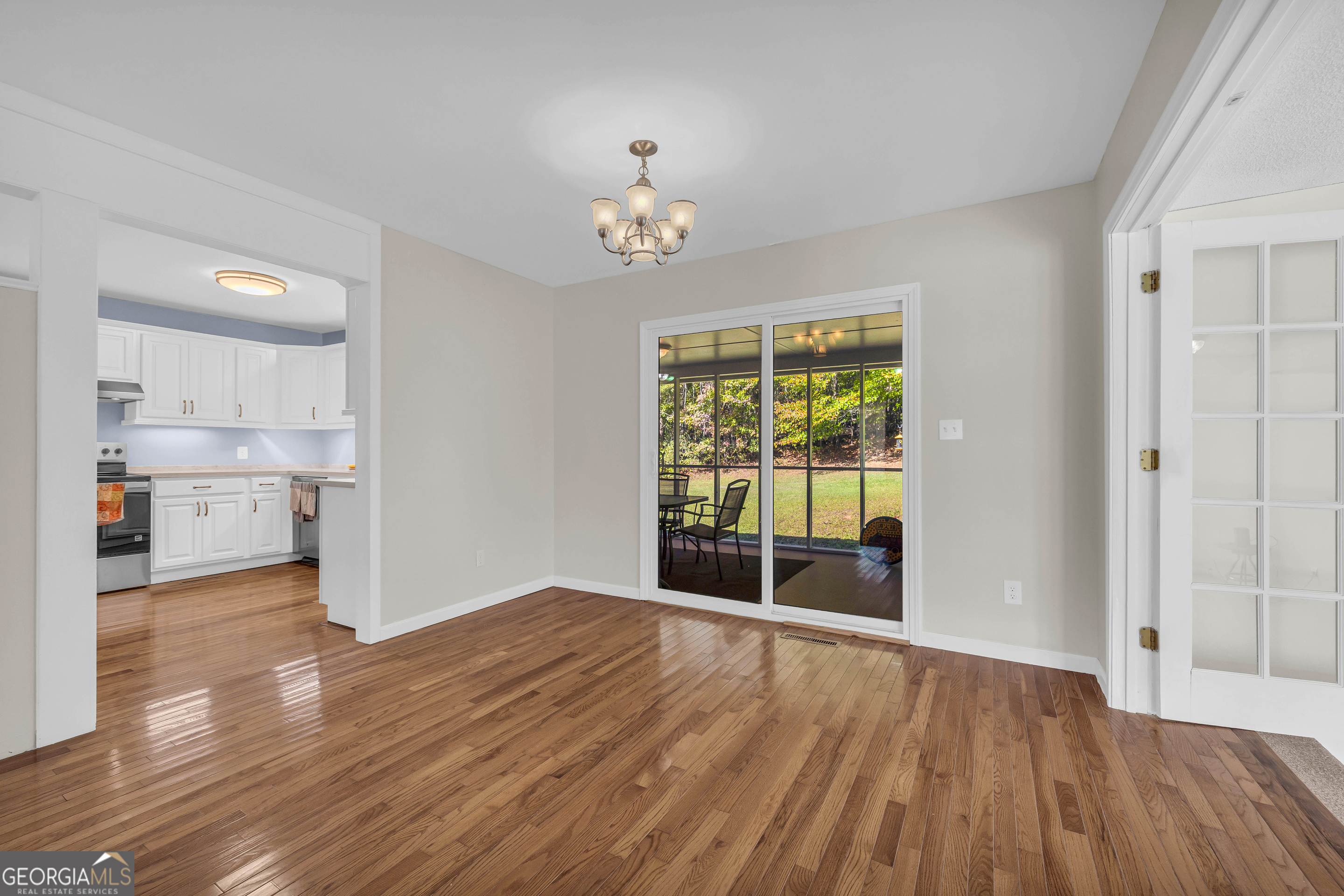 97 Estatohe Circle Toccoa, GA 30577 - Photo 14 of 54 an empty room with wooden floor and windows